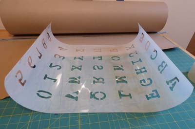 How to flatten a curled stencil
