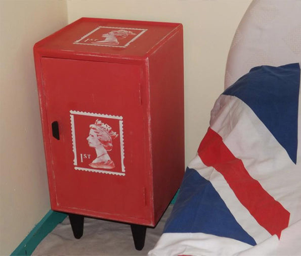 queens head stamp stencil on red bedside table