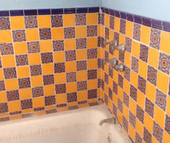 Mexican tile bathroom tub surroundings with trim
