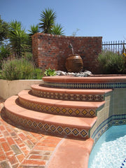 Mexican tile outdoor pool with stairs