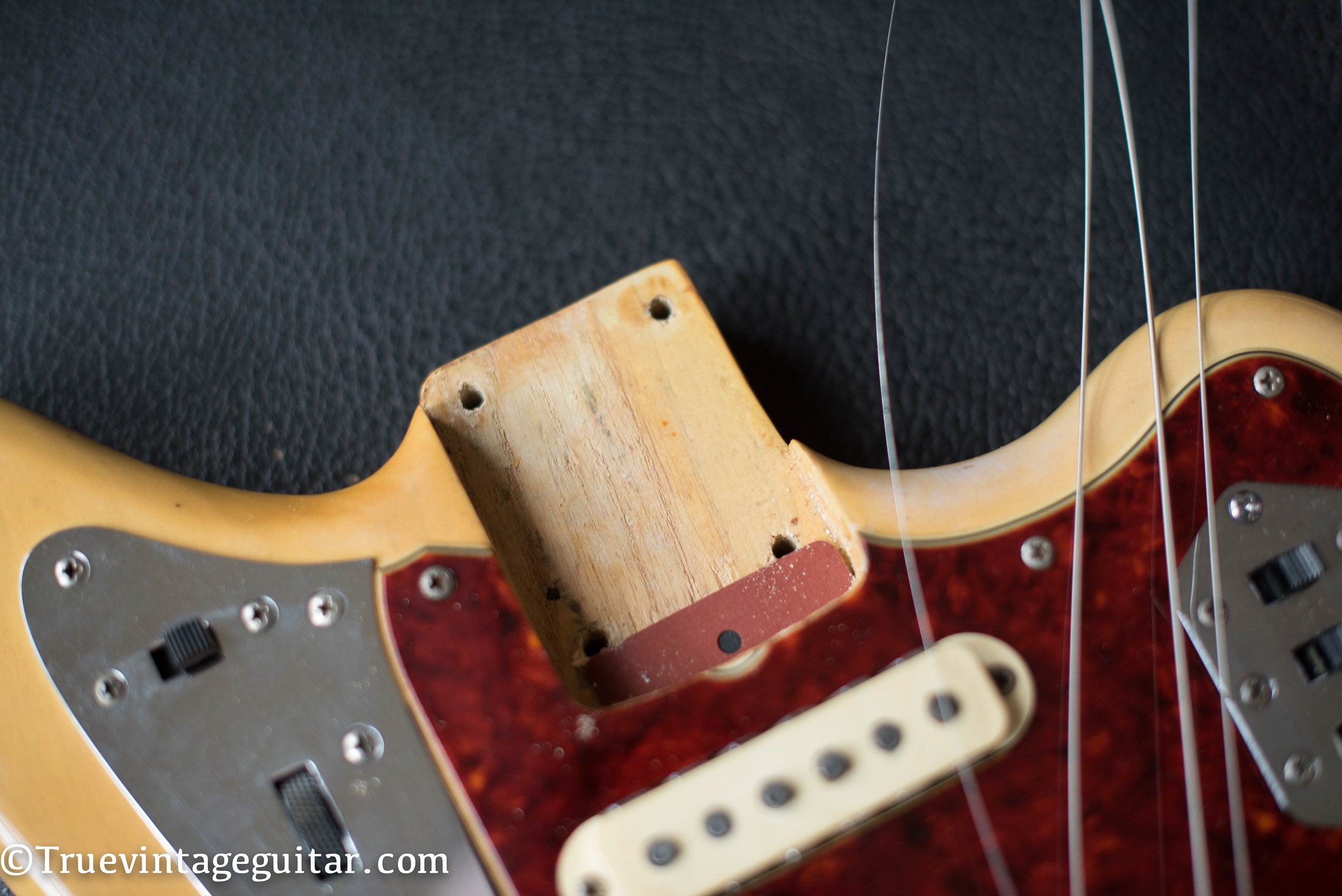 Neck pocket, paint stick mark, Vintage 1964 Fender Jaguar electric guitar Blond finish Ash body