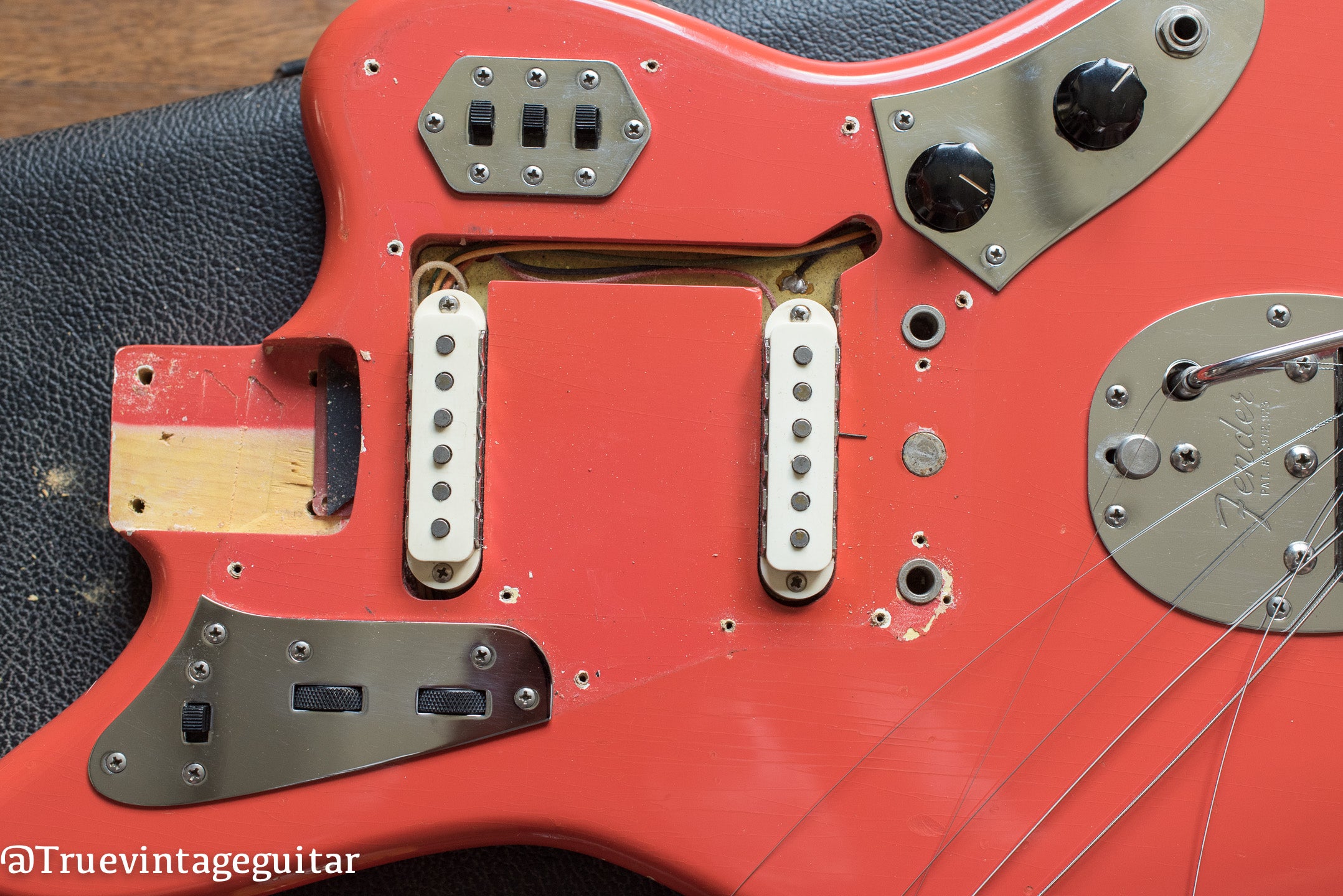 1965 Fender Jaguar Fiesta Red neck pocket and under pickguard