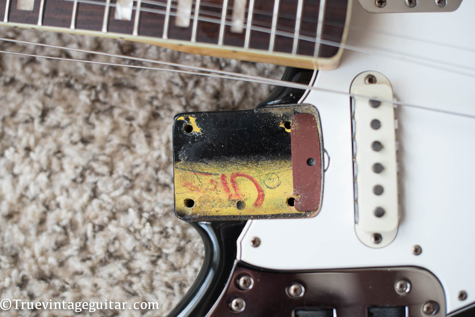 Neck pocket, paint stick mark, factory custom color Black finish, vintage 1966 Fender Jaguar electric guitar