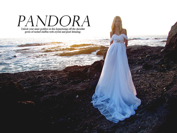 Off-the-shoulder ruched chiffon a-line gown with swarovski crystal and pearl detailing. Shop Pandora by Lauren Elaine Bridal