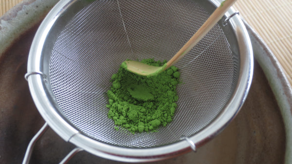 Phot of Matcha in a sifter