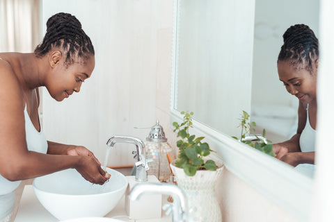 woman washing face