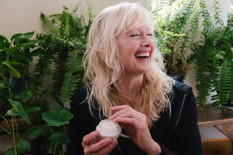 woman using revival moisturizer