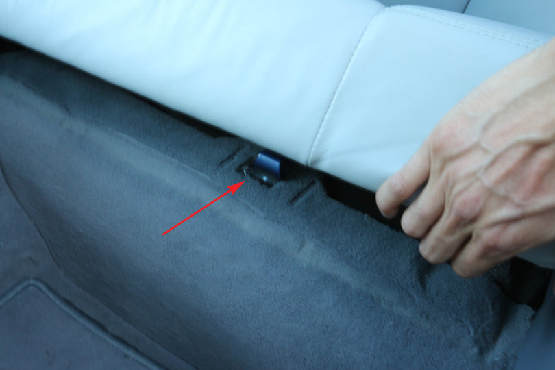Carpet attachment point under the rear seat.