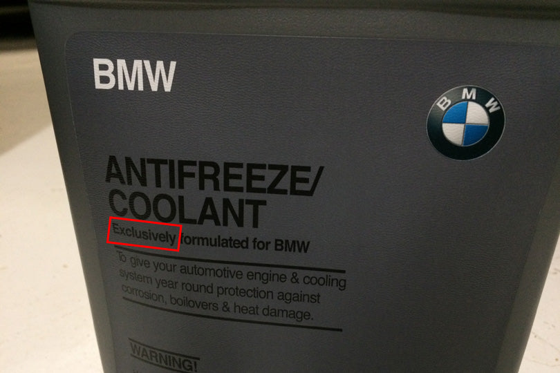 BMW coolant jug with "exclusively formulated for BMW" highlighted.