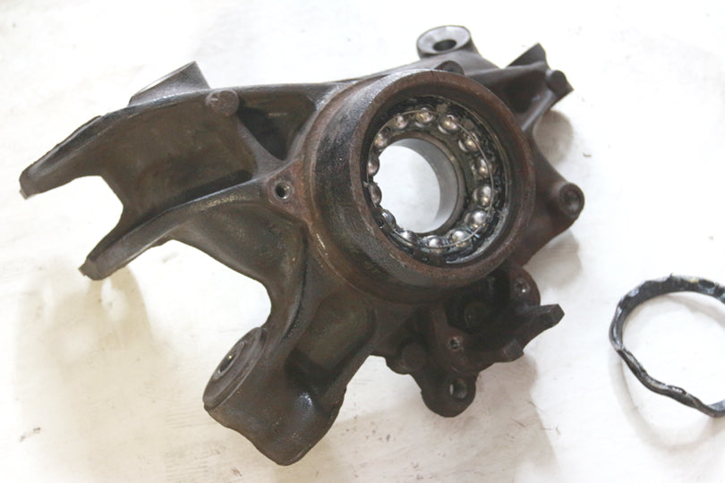 Wheel carrier with remaining parts of wheel bearing still inside.