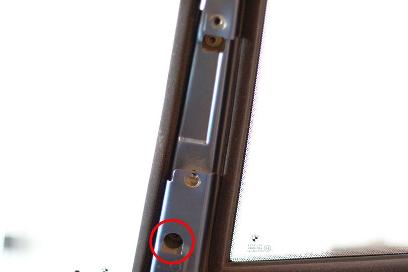 Location of one of the two fasteners that holds the rear side window to the B pillar.