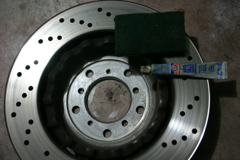 Brake rotor with a small amount of anti-seize compound on the mating surface.