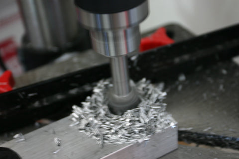 Counterbore bit chucked up in the drill press counterboring the aluminum bar stock.