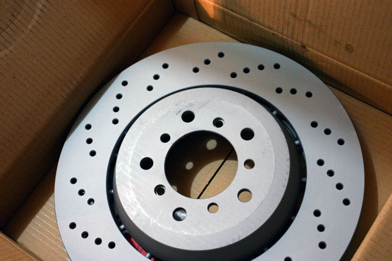 New brake rotor in box.