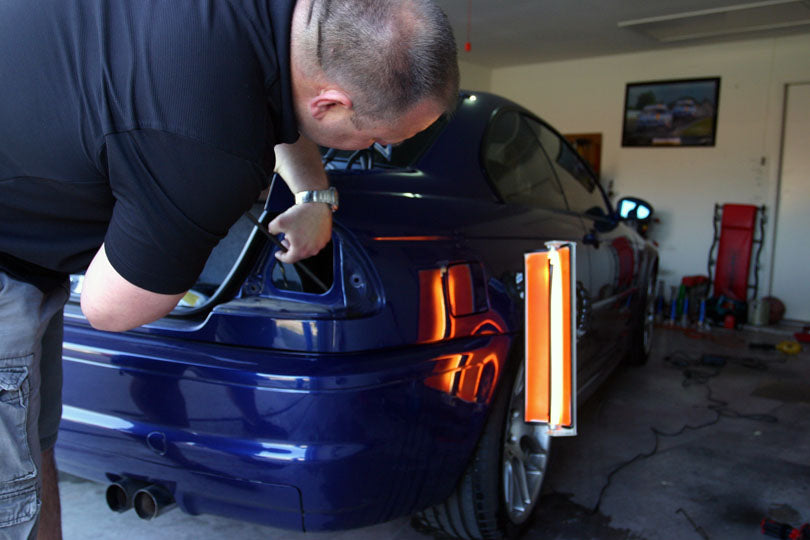 Paintless dent repair in progress.