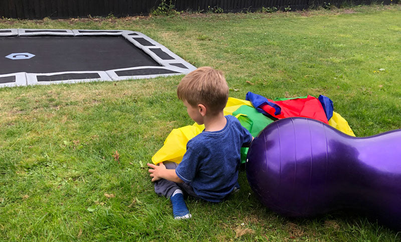 Theo playing on trampoline