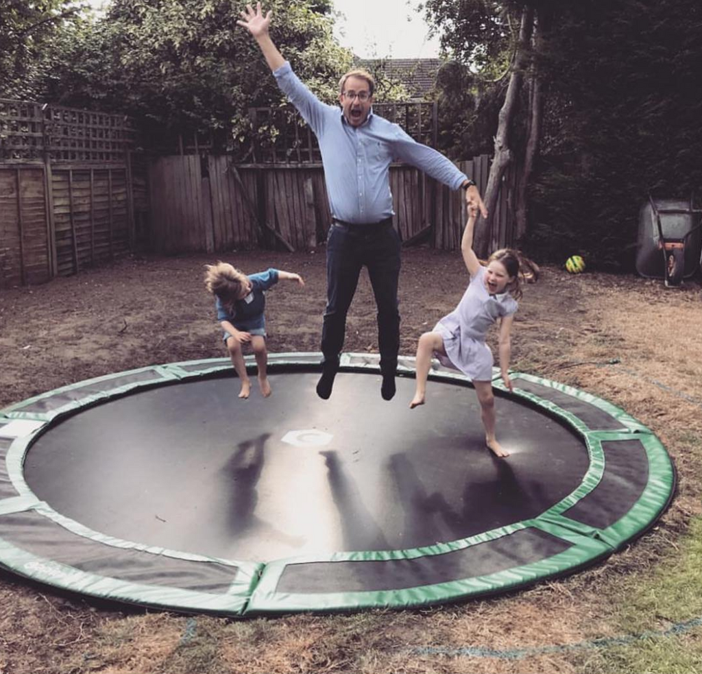 dad and girls on trampoline