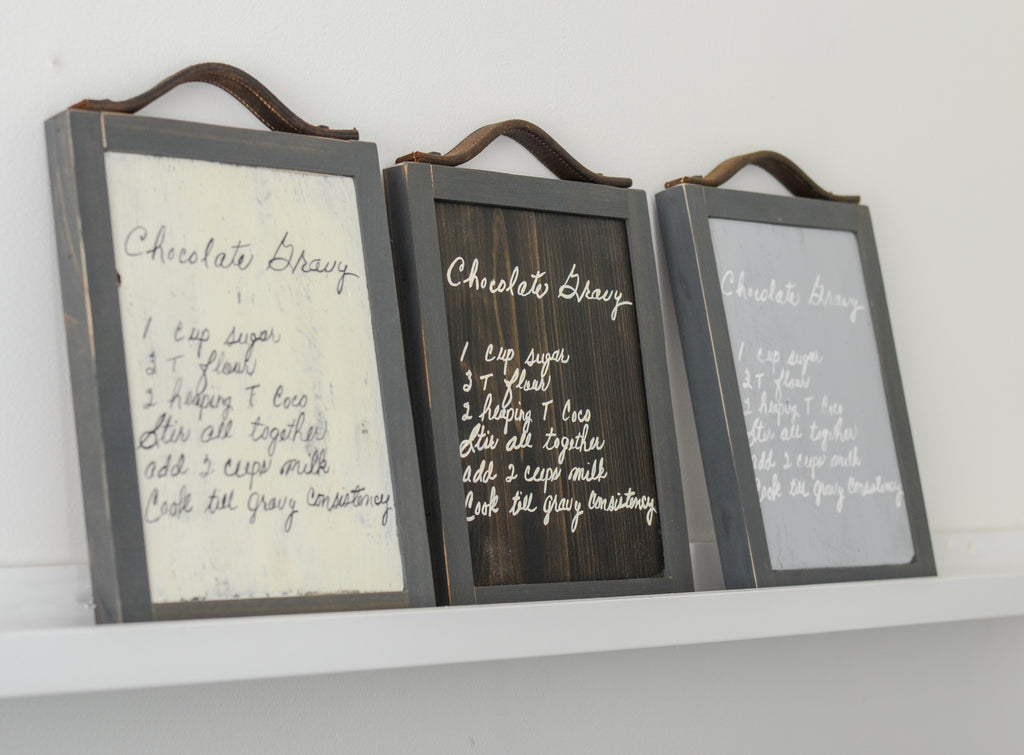 Handwriting memory sign for gravy recipe in white, brown and grey sitting on ledge