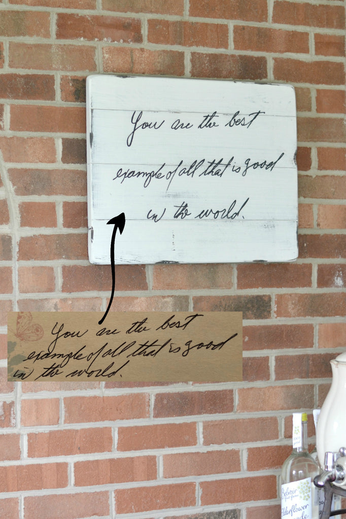Handwriting memory sign on white wood hanging on brick wall "you are the best"
