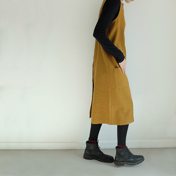 Simple in form, this easy-to-wear dress is cut perfectly from fine wool, with minimal shapes. It is also available in both charcoal and navy, along with this mustard linen alternative.