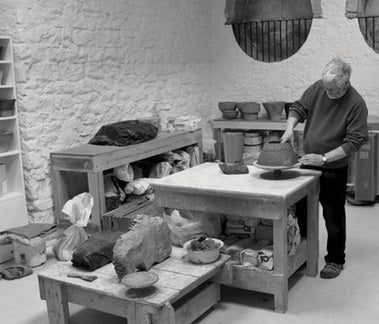 Paul Philp at work in his ceramics studio hand building a unique vase