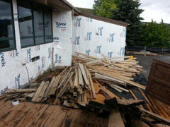 Siding is carefully removed, denailed, sorted, bundled and measured before being donated. 