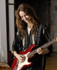 Saffron Burrows wears Catherine Angiel jewelry in the movie, Guitar