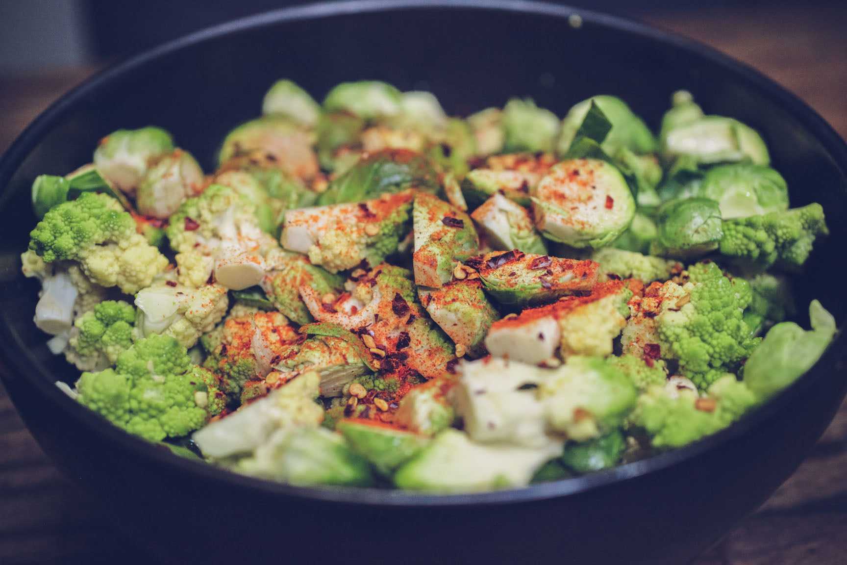 spread spices over vegetables