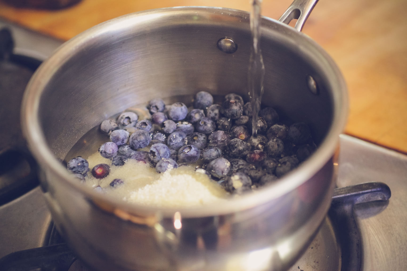 put blueberries in saucepan