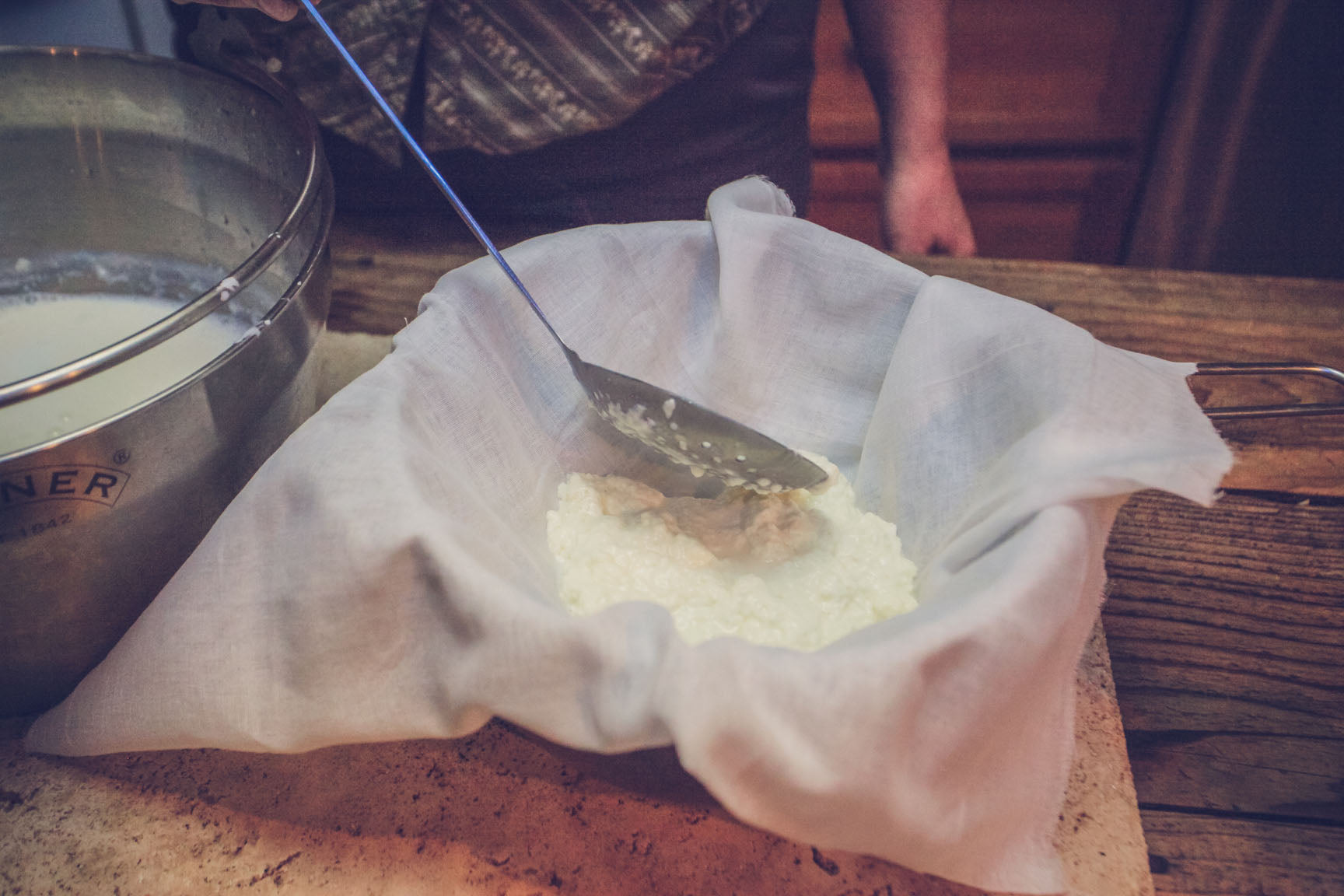 ladle curd into cheesecloth