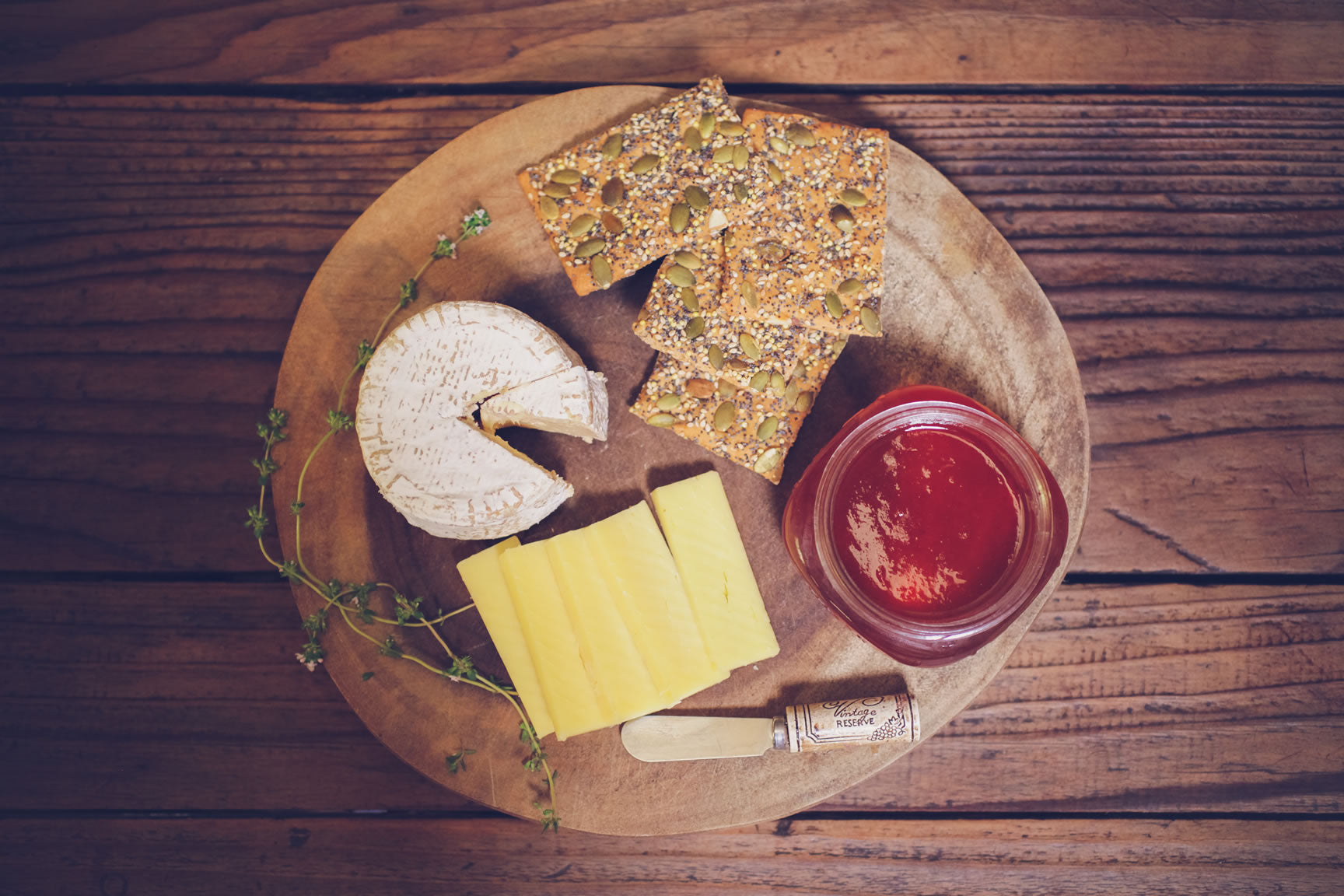 herb jelly on cheese platter