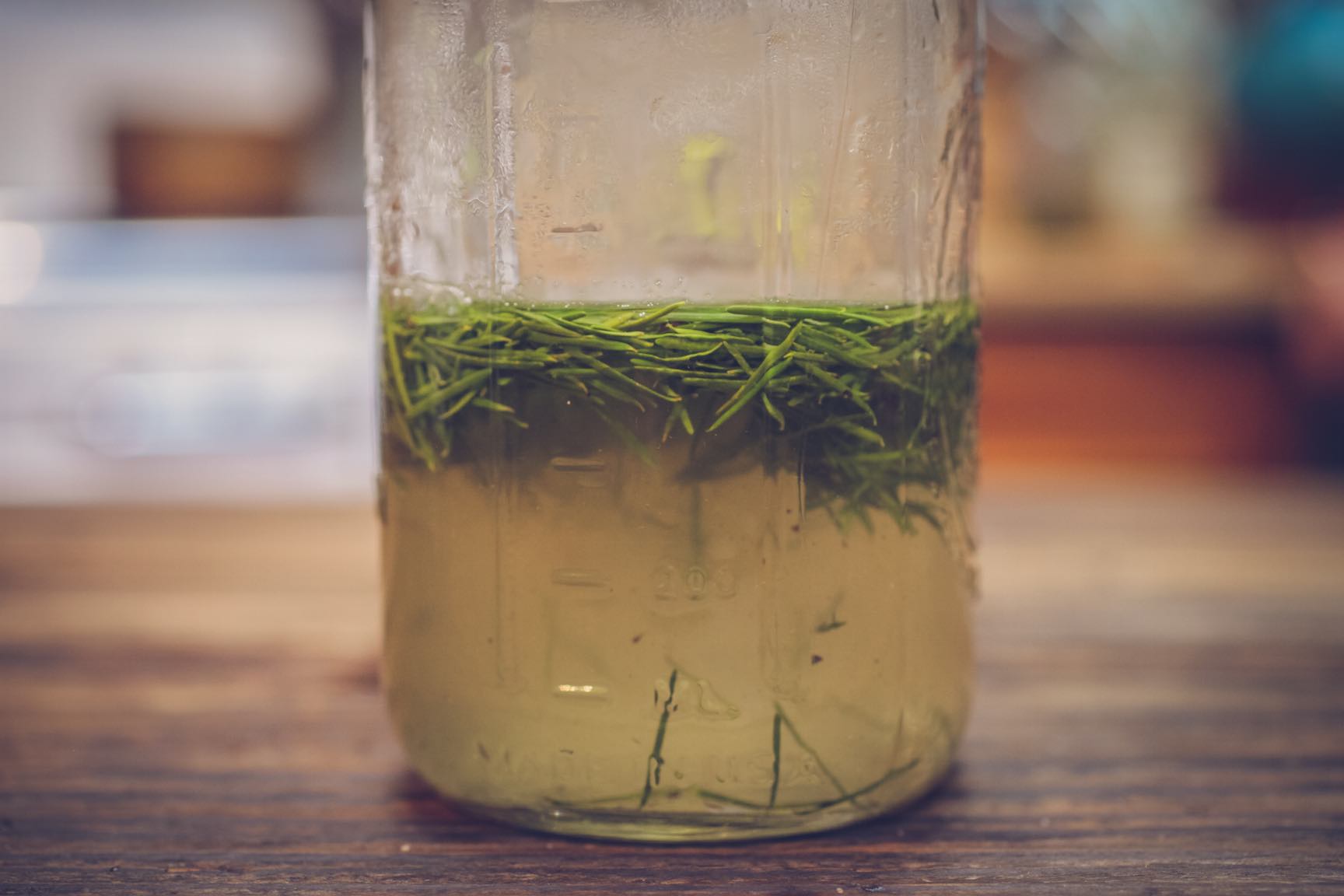 making tree pine needle simple syrup for homemade old fashioned cocktail