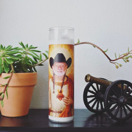 Willie Nelson prayer candle on desk