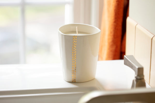 Linnea Gold Candle - handpoured by women artisans in Massachusetts and handcrafted by Tandem Ceramics