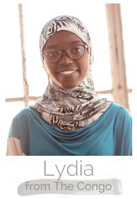 Lydia a Congolese woman makes handcrafted soy blend fair trade candles at Prosperity Candle