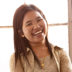 Sui Burmese refugee makes handcrafted soy blend fair trade candles at Prosperity Candle