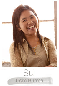 Sui a Burmese woman makes handcrafted soy blend fair trade candles at Prosperity Candle