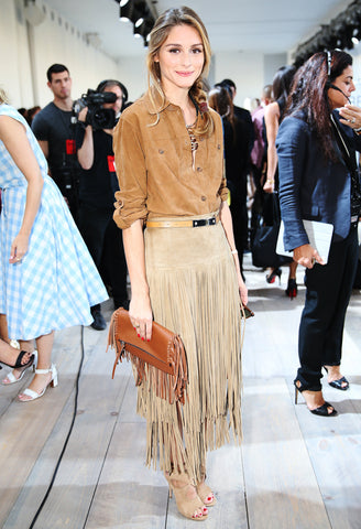 Olivia Palermo wearing a belted fringe Michael Kors skirt and a suede blouse