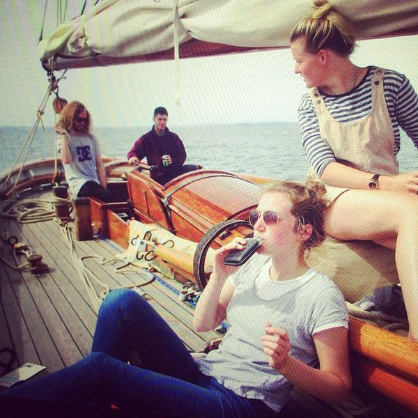 SWIG Flasks women on a boat