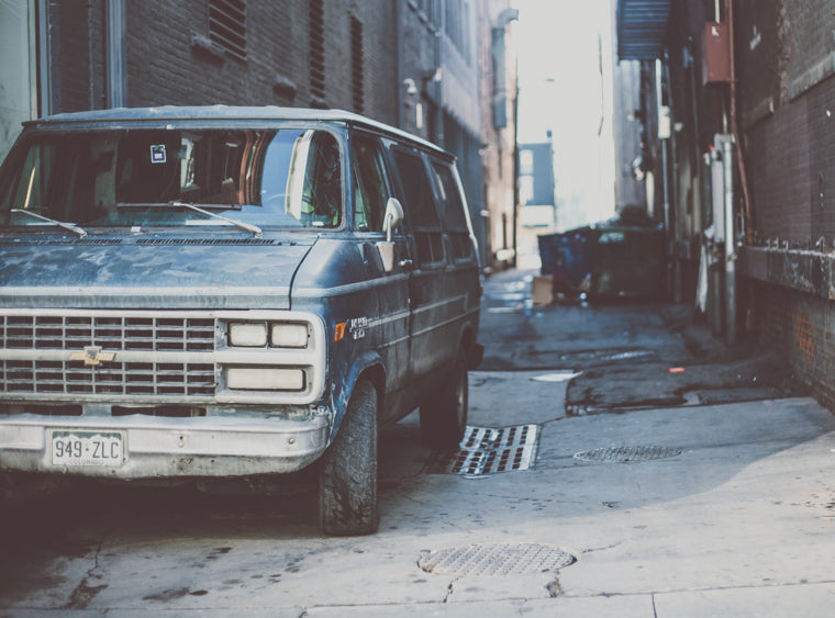 photo of downtown denver alleyway with old van