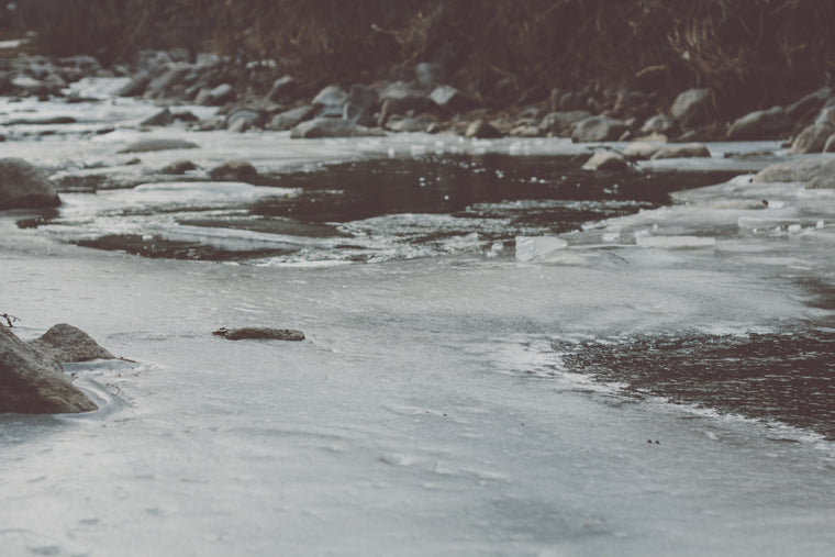 Photo of Boulder Creek frozen during winter