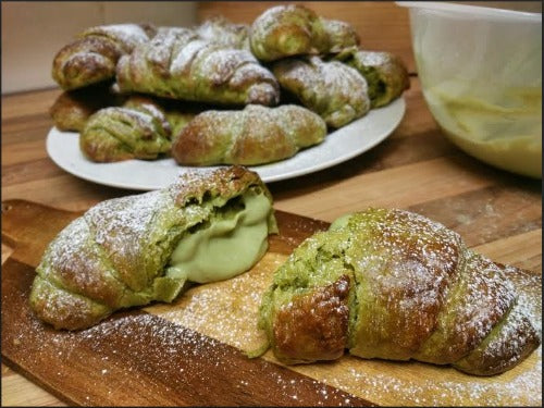 Freshly oven baked matcha green tea croissants filled with green tea matcha custard are the best breakfast dessert you would get!