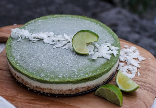 vegan raw matcha pine lime cheesecake is made with coconut-almond base held together with mejool dates and layered with 2 cheesecake layers - pineapple coconut and matcha lime. 
