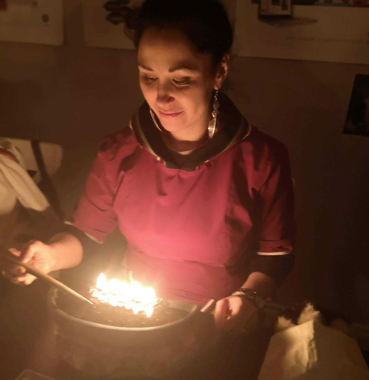 Bernice Clarke performing qulliq using bowhead whale oil