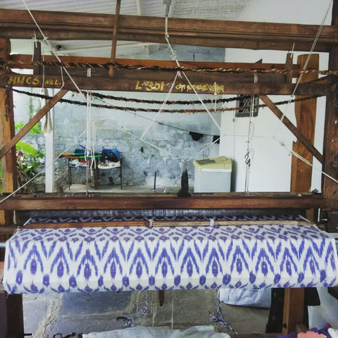 Passion Lilie's handwoven clothes made in India involve fabric produced by a loom, such as the loom pictured here.