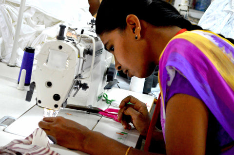 Geetha, the first participant in Passion Lilie's job training program, using a sewing machine.