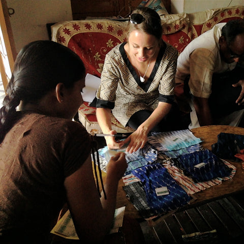 Discussing price with a group of hand loom weavers.