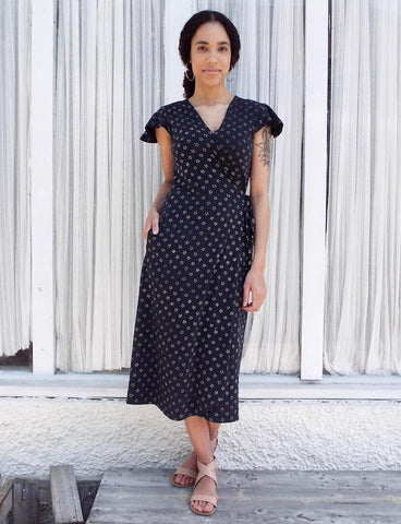 Planning a sustainable dinner party doesn't stop after you procure your ethical food, dishes, utensils, and cloth napkins. Make sure your outfit is just as classy and ethical as the rest of the party with this Navy Stars Organic Jersey Wrap Dress from Passion Lilie.