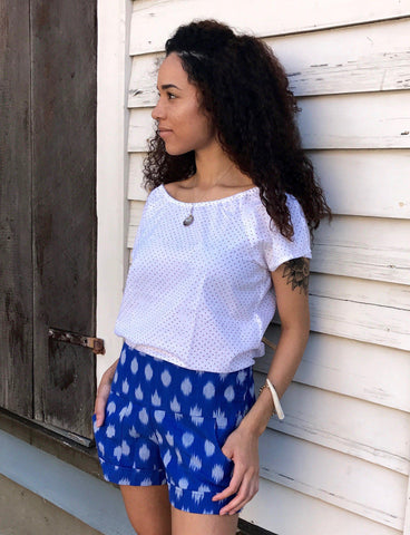 These Playful Blue Shorts from Passion Lilie feature a flat front with elastic in the back and pockets for maximum comfort and style during a music festival.
