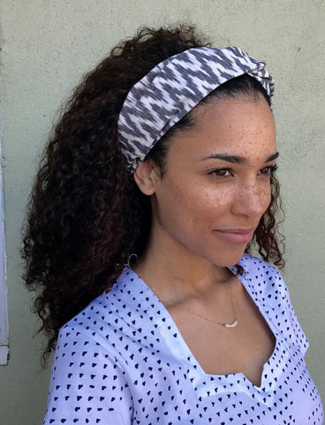 The stylish ikat pattern on Passion Lilie's Chevron Headband makes for a great way to accessorize with an ikat print.